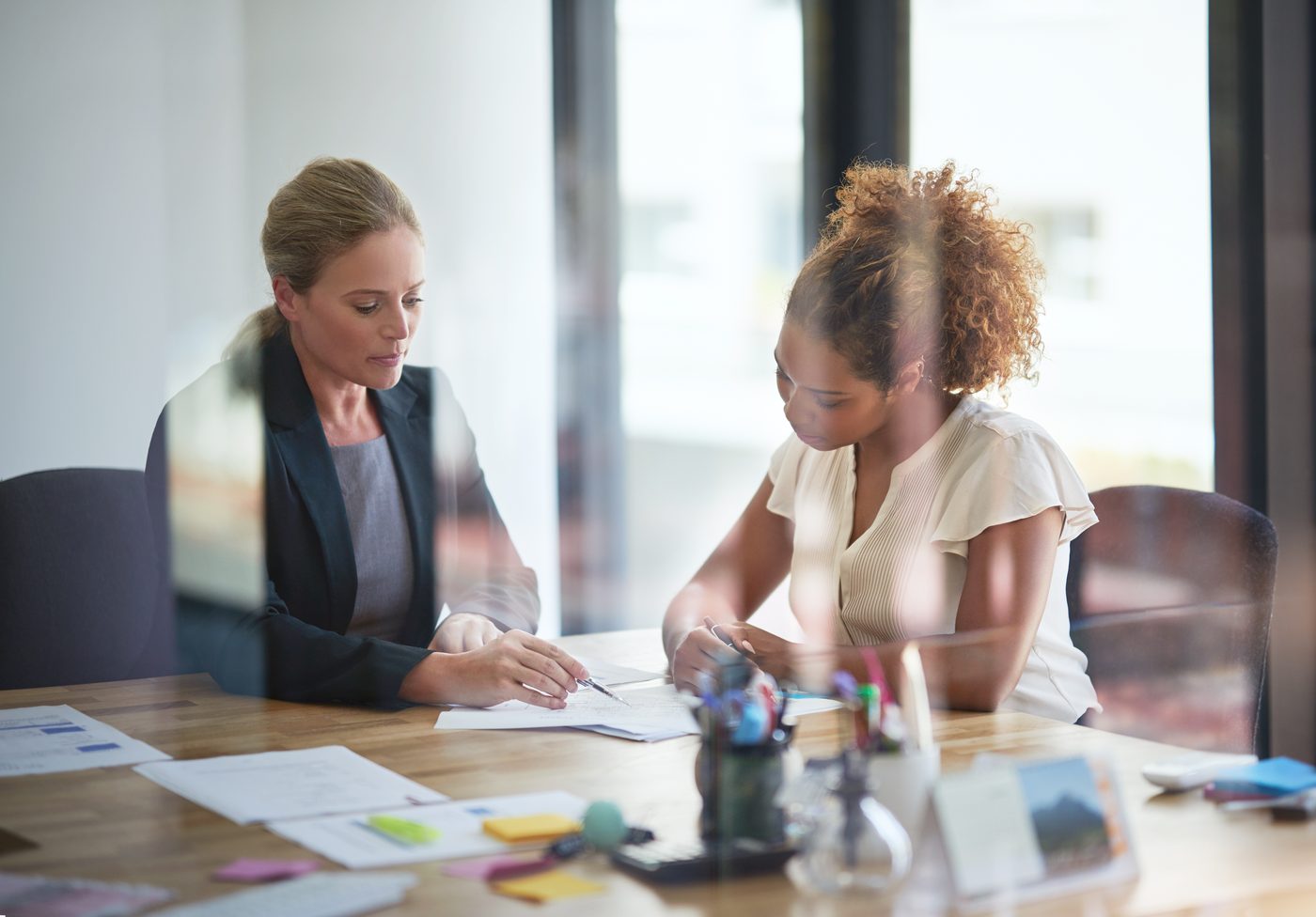 Two Aner Group specialists reviewing controls and audit evidence